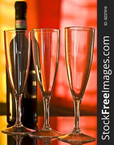 Champagne glass with yellow and orange background. Champagne glass with yellow and orange background