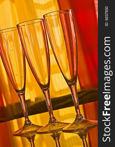 Champagne glass with yellow and orange background. Champagne glass with yellow and orange background