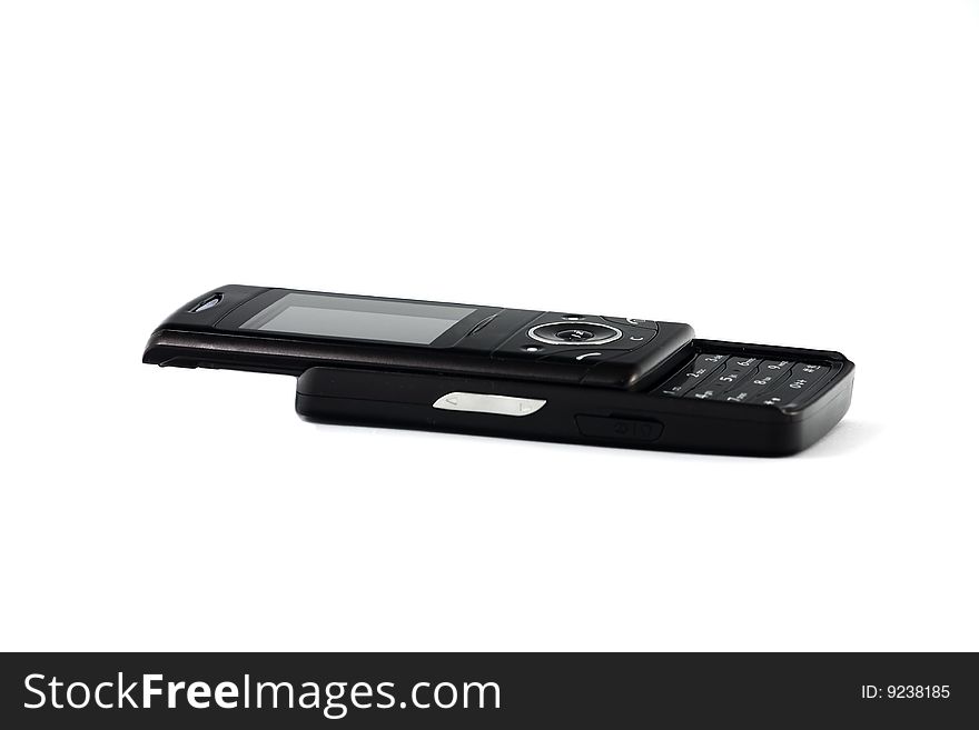 Black, slide-open mobile phone, isolated oven white. Black, slide-open mobile phone, isolated oven white