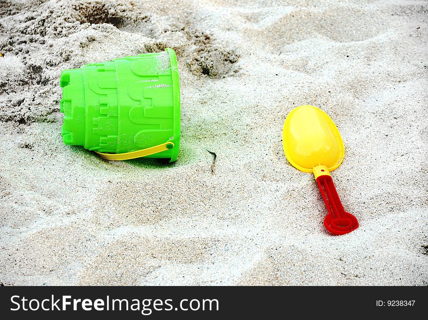Color beach toys on beach sands. Color beach toys on beach sands