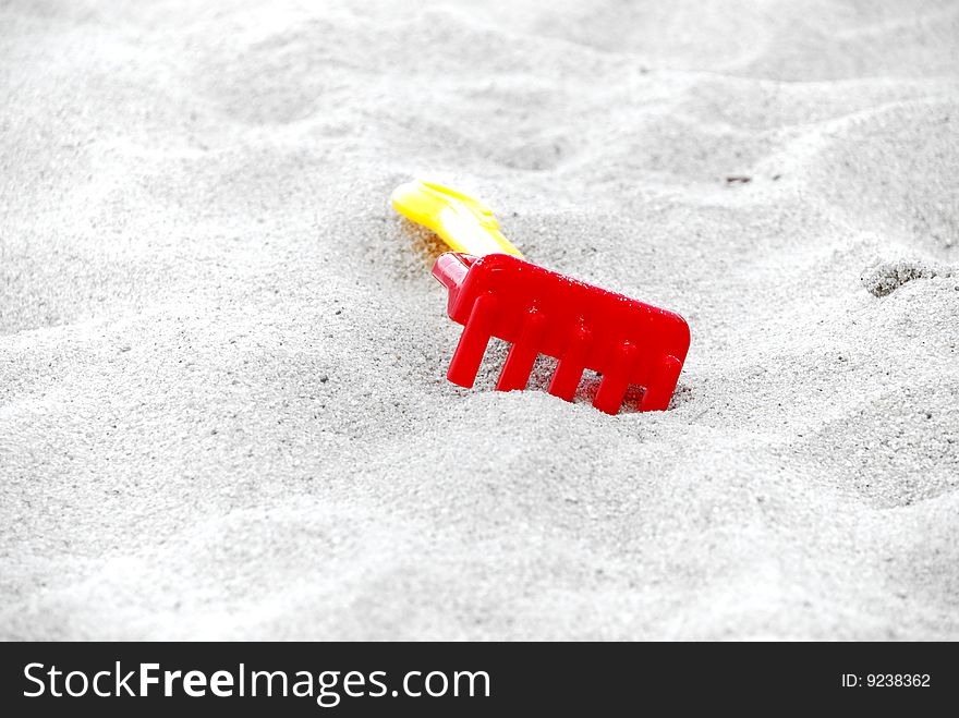 Isolated Color beach toys on beach sands. Isolated Color beach toys on beach sands