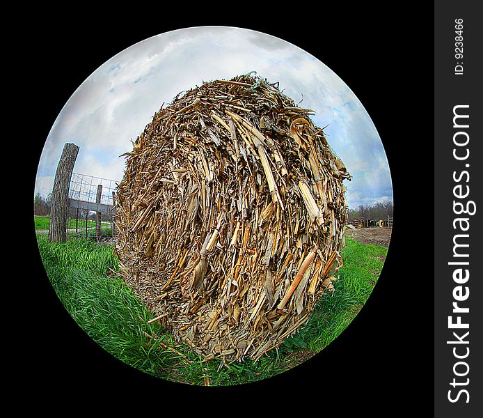 A bale of hay out on the farm