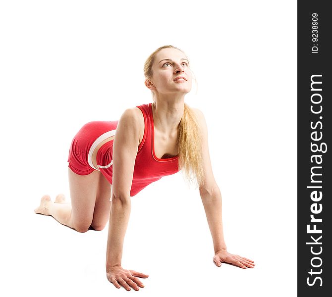 A pretty young blond girl in red underwear doing her gymnastic exercises. A pretty young blond girl in red underwear doing her gymnastic exercises