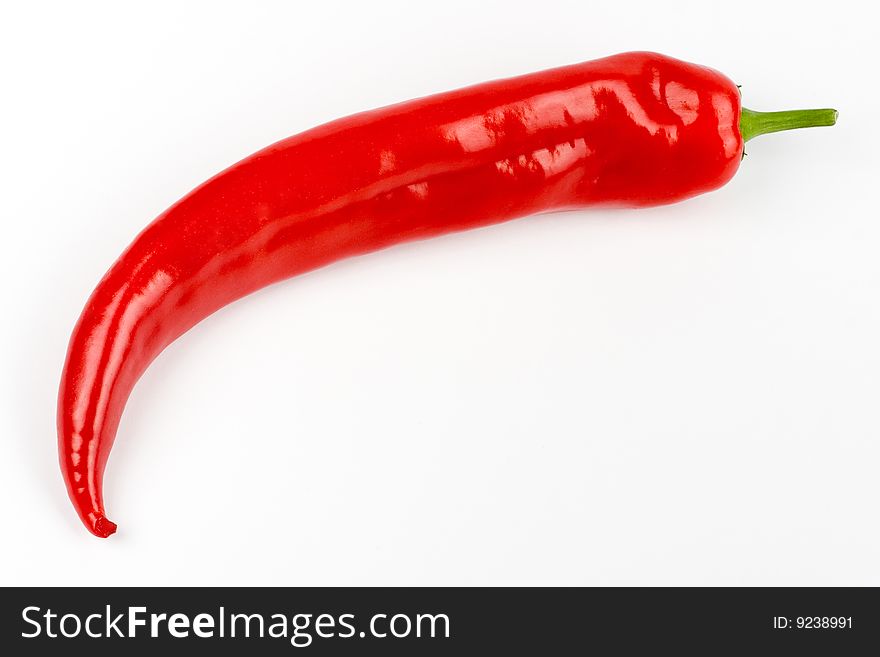 A pod of red Chile on a white background. A pod of red Chile on a white background
