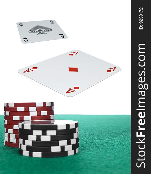 Two aces flying over the poker table. Red and black chips on the foreground. Two aces flying over the poker table. Red and black chips on the foreground.