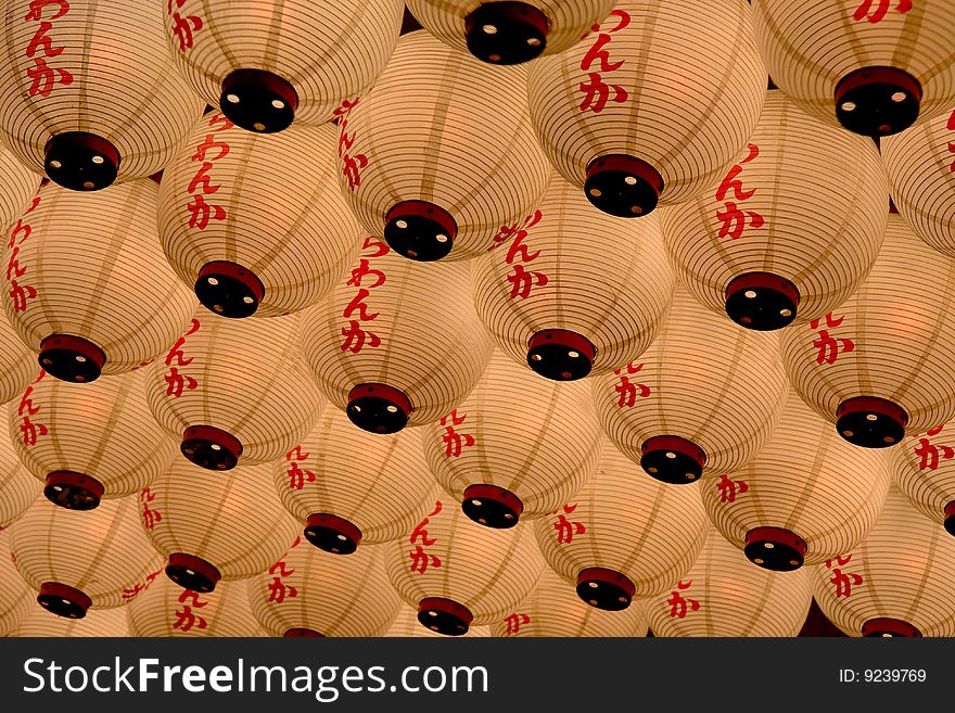 A ceiling of lanterns hanging outside a restaurant in Japan. A ceiling of lanterns hanging outside a restaurant in Japan