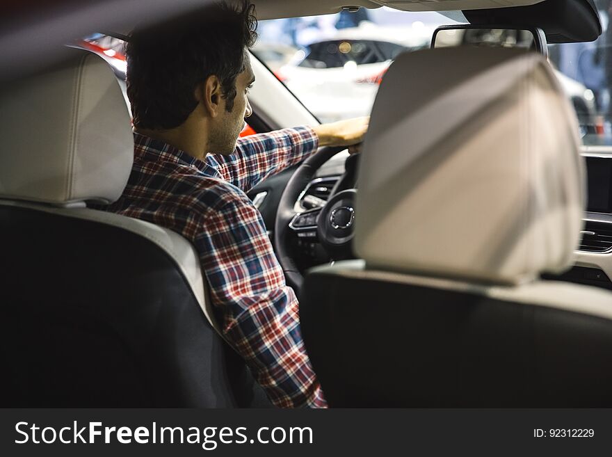 Young Man Driving Car