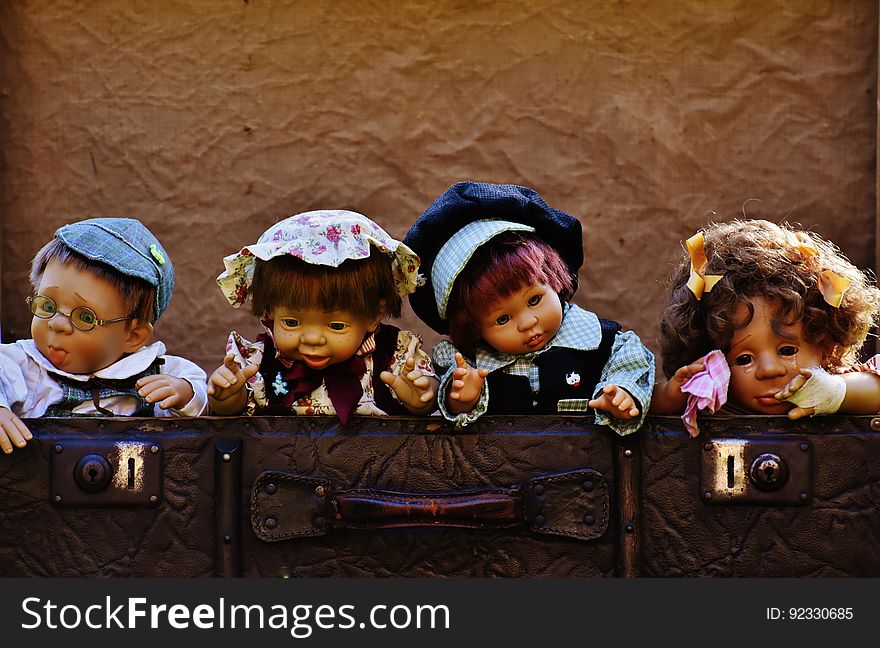 Dolls In Suitcase