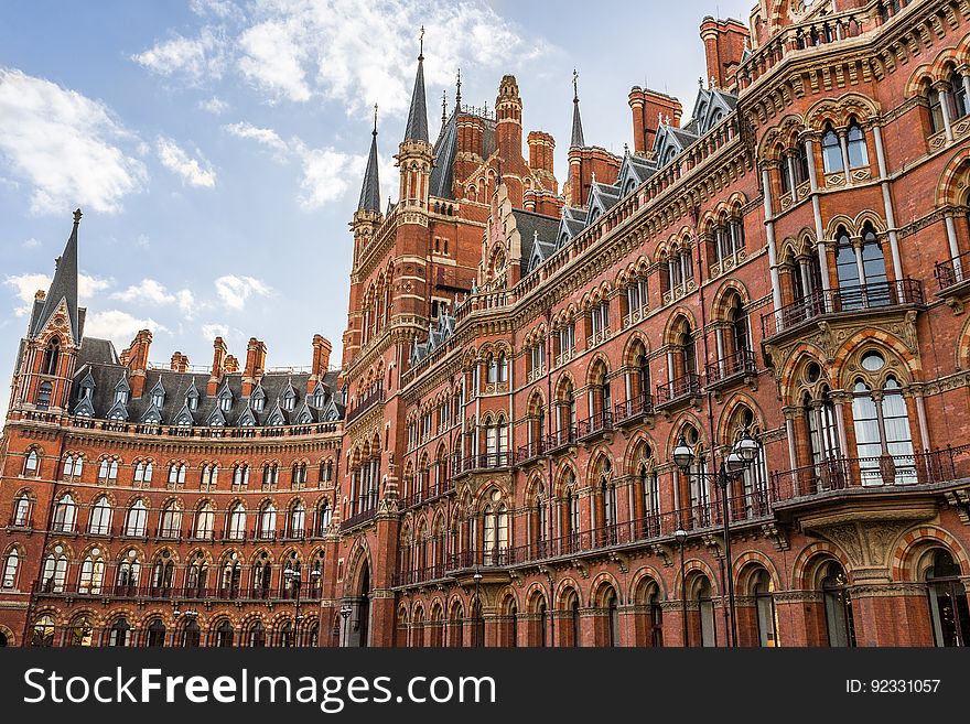 Brown Building during Sunny Blue Cloudy Sky