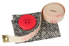The Sample Of A Fabric With A Button And A Measure Royalty Free Stock Photos
