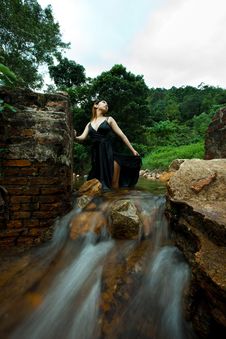 Relaxing Young Woman At Waterfall Stock Image Relaxing Young Woman At Waterfall Stock Image