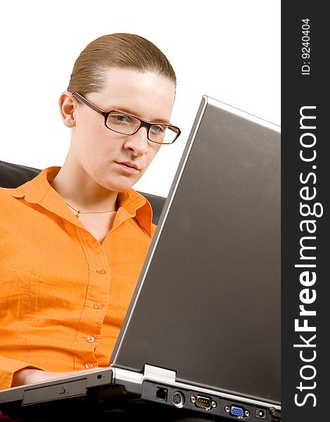 Young woman working on laptop on white ground