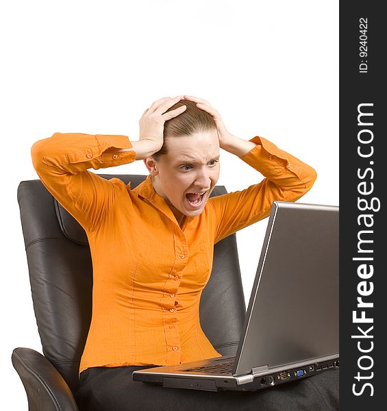 Young woman screaming at laptop isolated