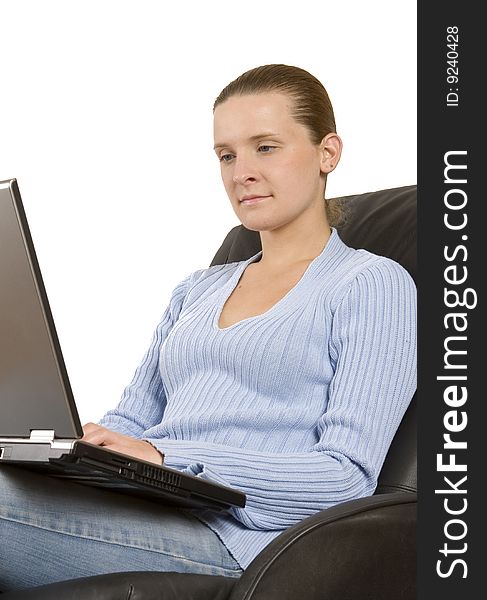 Young woman working on laptop on white ground