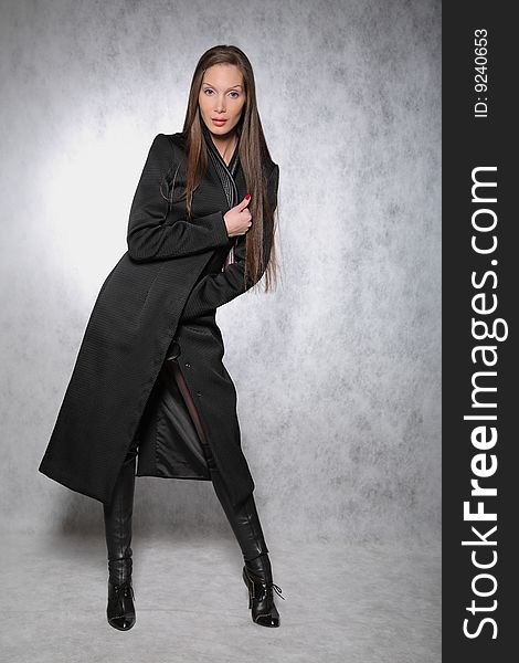 Woman in a coat posing