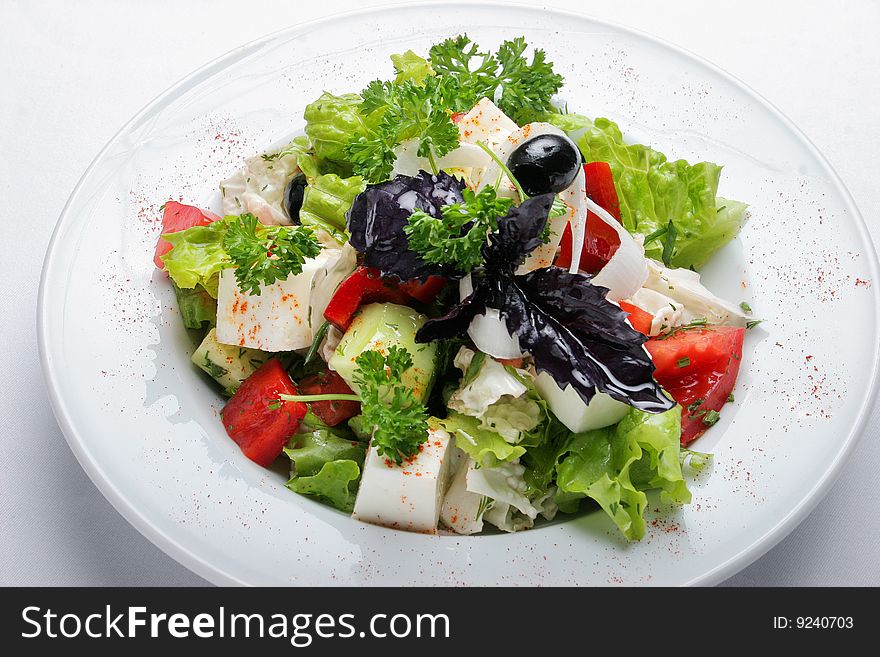 Greek lettuce on a white dish. Greek lettuce on a white dish.