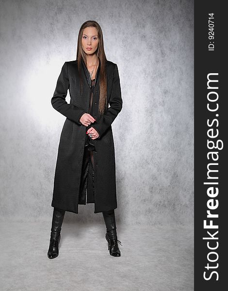 Woman in a coat posing