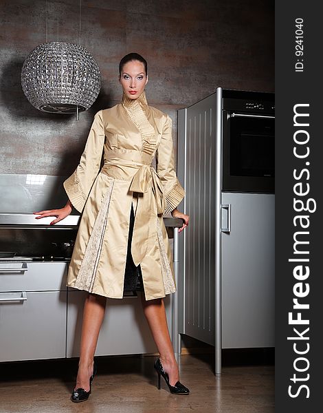 Woman posing on a kitchen. Woman posing on a kitchen