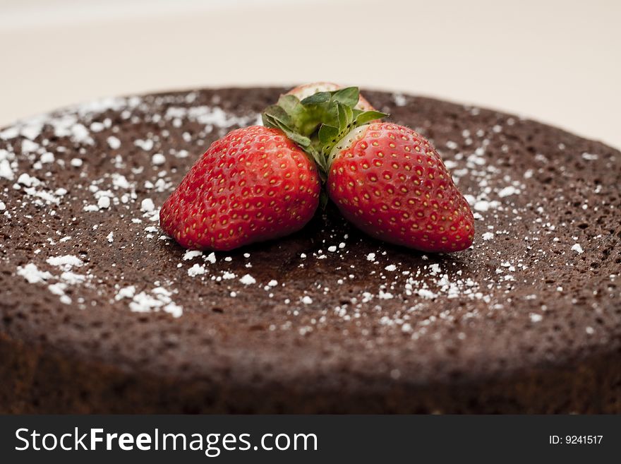 Chocolate mud cake topped with strawberries