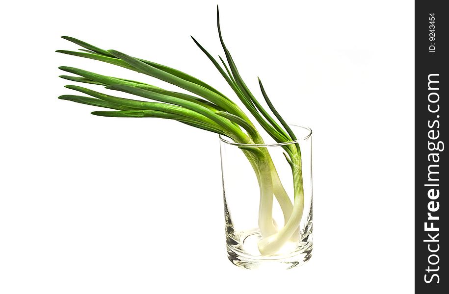 Bunch of onion. Green onion as background. Isolated on a white