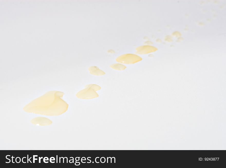 Yellow drops on a white background