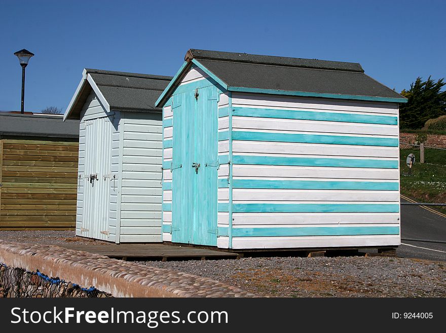 Multi coloured breach huts at seaside. Multi coloured breach huts at seaside