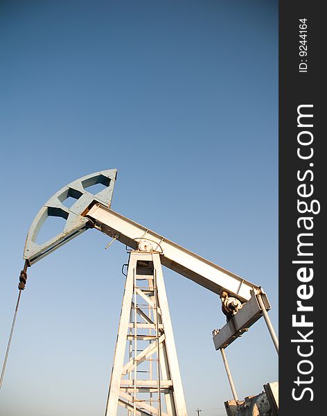 Oil pump on a background blue sky