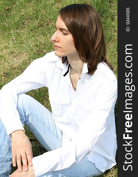 Young man resting outdoor in a park