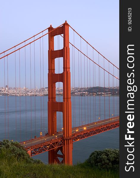 The Golden Gate bridge is shown here during sundown, from the vantage point of Marin Headlands in San Francisco, California.