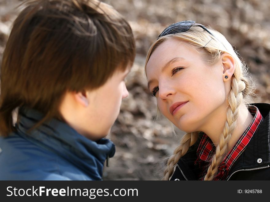Two young people in the park, emotion scene. Two young people in the park, emotion scene