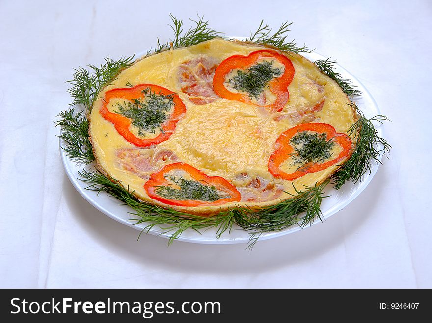 Scrambled eggs with baked tomatoes and grated cheese