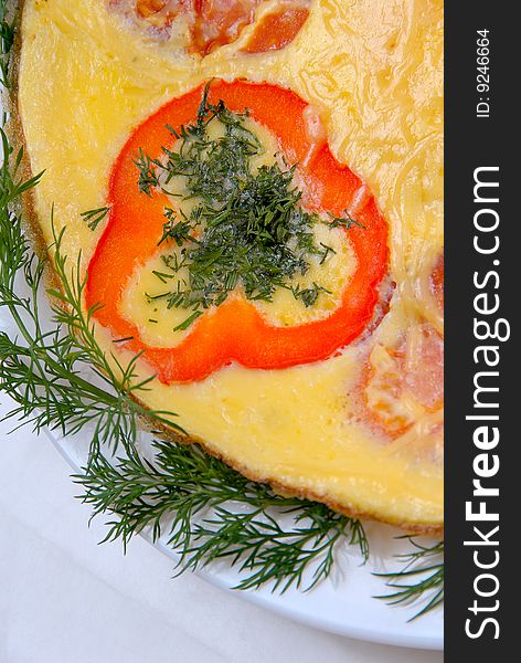 Scrambled eggs with baked tomatoes and grated cheese