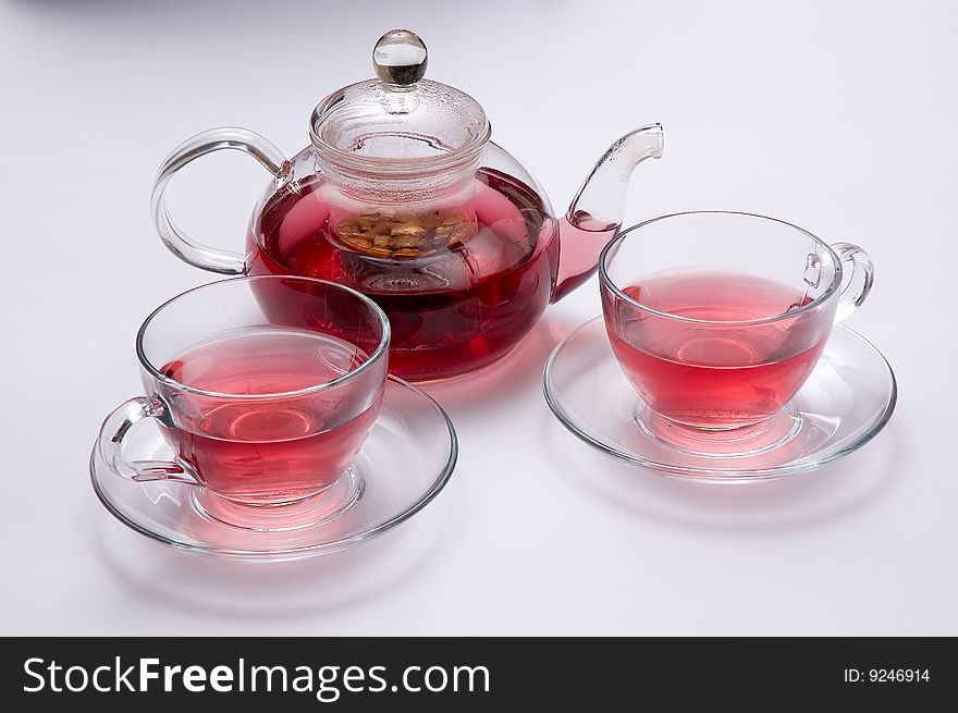 Glass teapot with fruit and two cups of tea. Glass teapot with fruit and two cups of tea