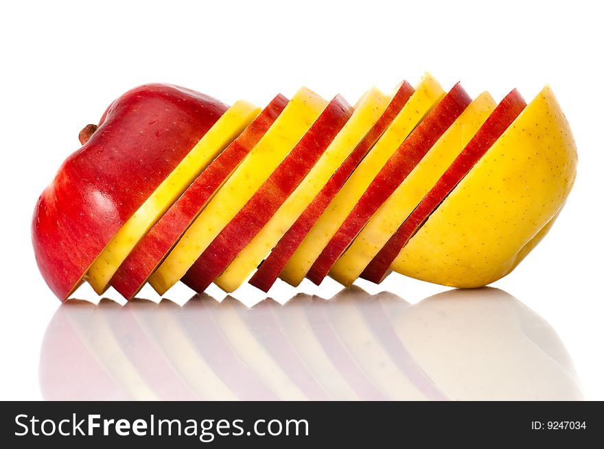 Alternate block of red and golden apple slices isolated on the white background