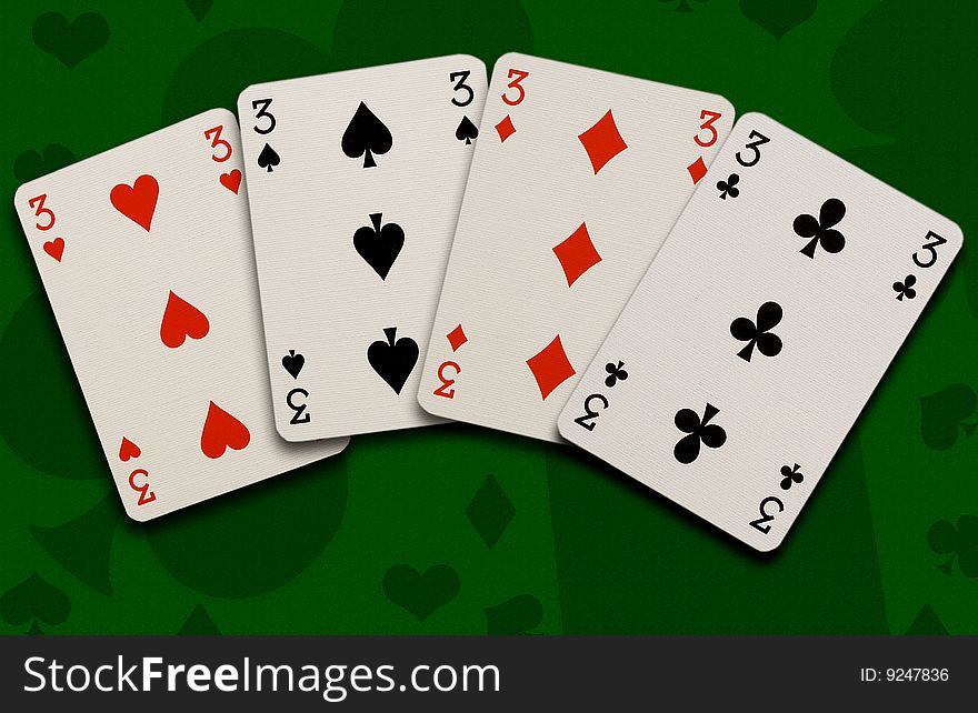 Playing cards on green background