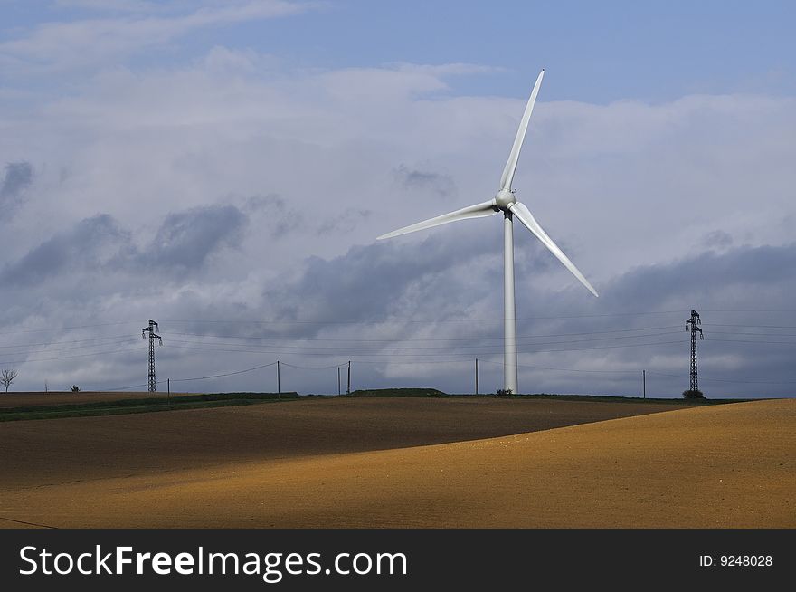 A wind turbine in field, south of France