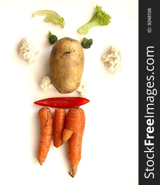 A vegetable face with different vegetables. A vegetable face with different vegetables