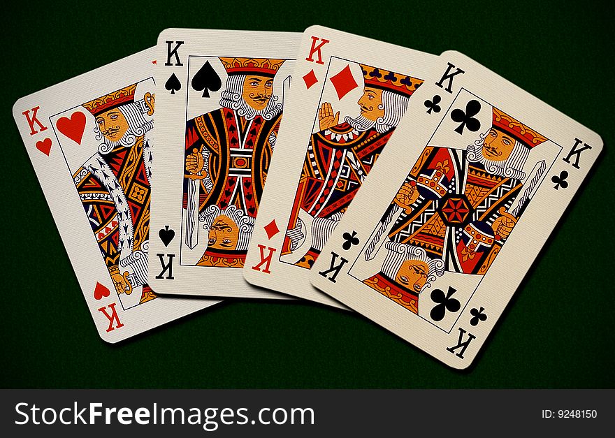 Four kings on green background