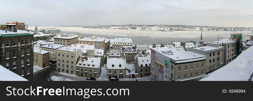 A panorama of Quebec City and the St. Lawrence River in winter