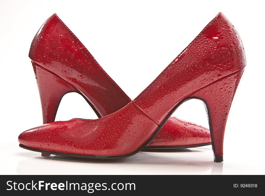 Wet red high heel shoes. Wet red high heel shoes