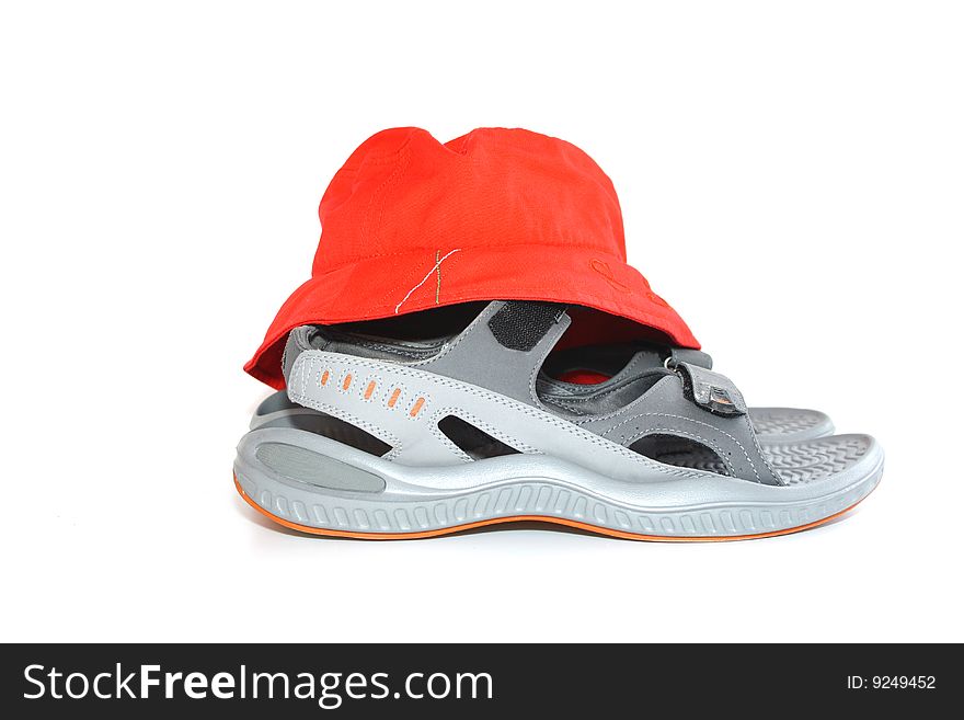 On a white background sandals and cap