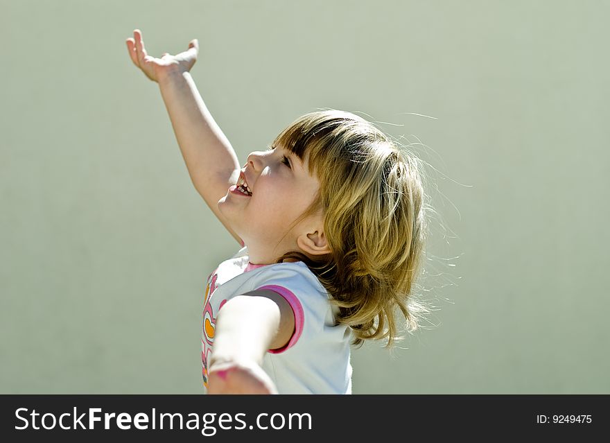 A little girl playing outside, summer, playground. A little girl playing outside, summer, playground.