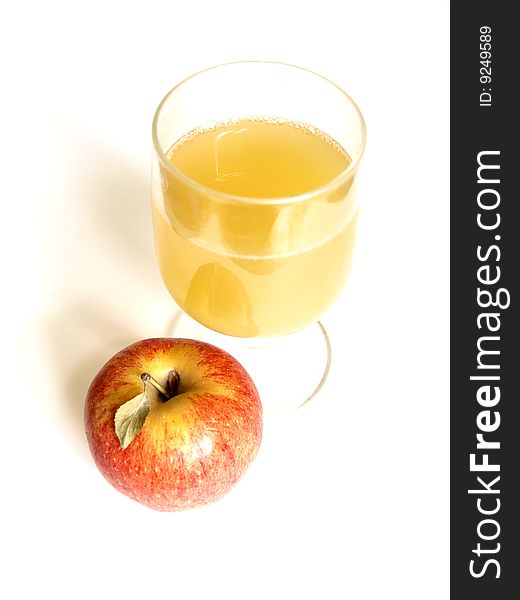Glass of apple juice and an apple