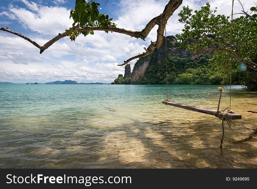 A lonly swing on the beach of paradise island, thailand