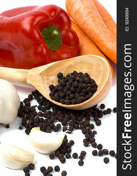 Carrots, red paprika, garlic, black pepper closeup. Carrots, red paprika, garlic, black pepper closeup