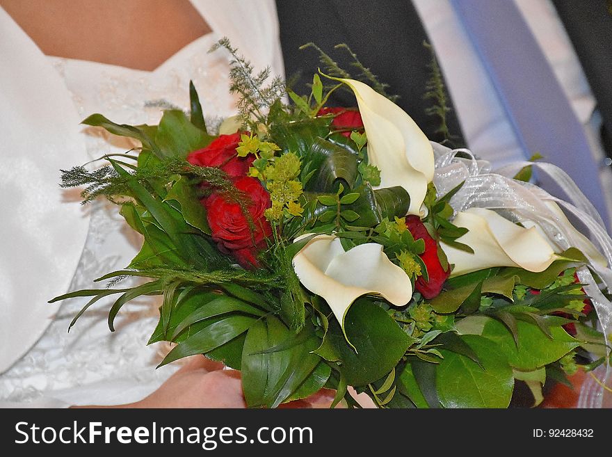 Closeup of a bride holding a bouquet. Closeup of a bride holding a bouquet.