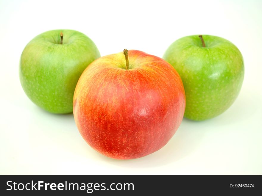 Red Apple With Two Green Apples