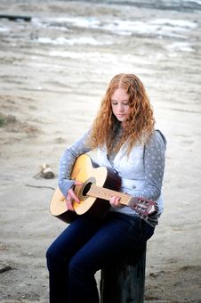 Girl By The Sea With Her Guitar Stock Photo Girl By The Sea With Her Guitar Stock Photo