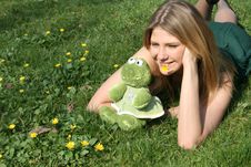 Funny Girl With A Toy Frog Royalty Free Stock Photography