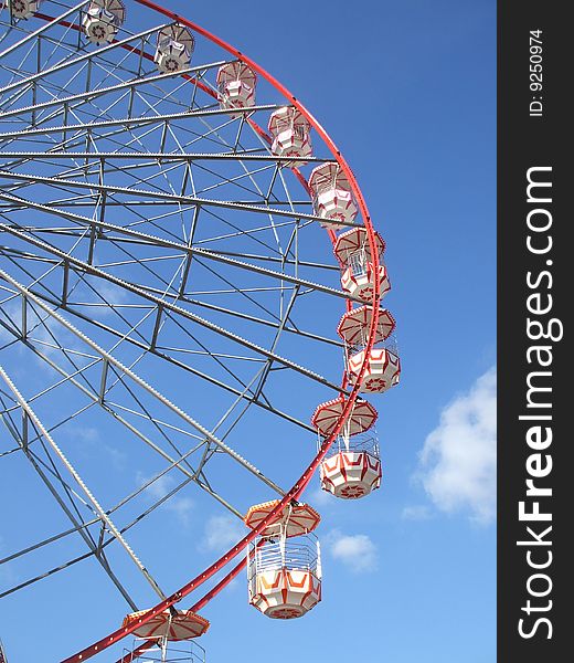 A Red and Silver Fun Fair Big Wheel.